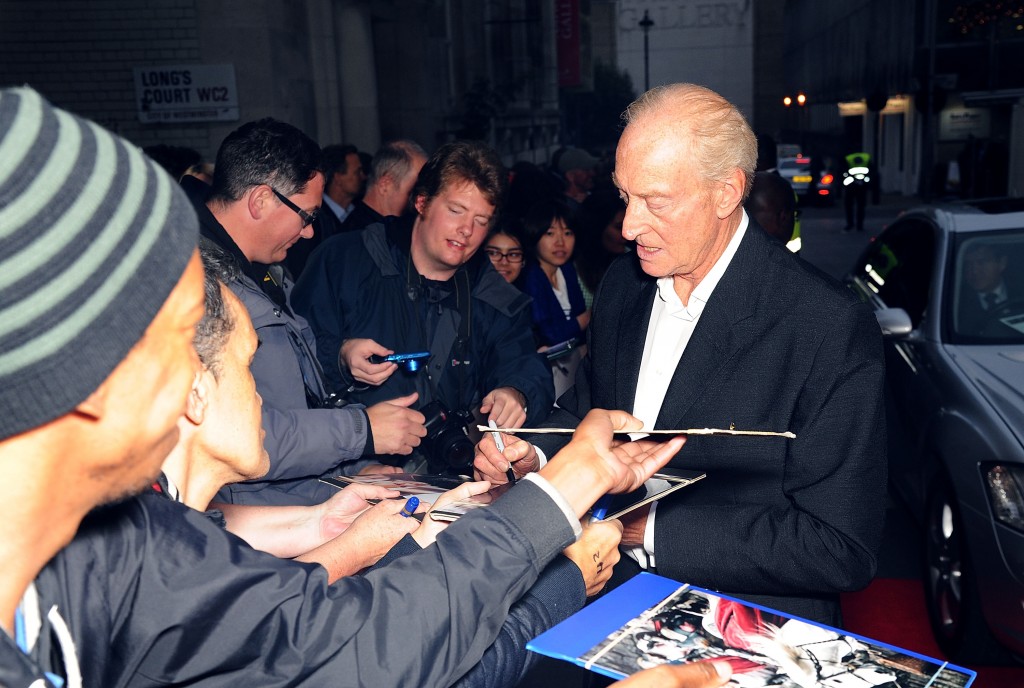 Charles Dance signing autographs for the eager fans. (Photo by Dave J Hogan/Getty Images for Universal Pictures) 